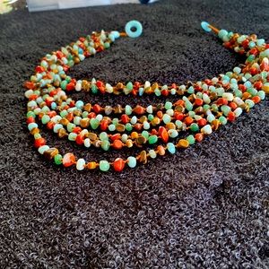 Beautiful necklace eight strings of beads blues and browns very classy